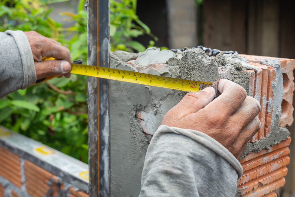 Bricklaying. Construction worker building a brick wall. Bricklaying. Construction worker building a brick wall.<br />